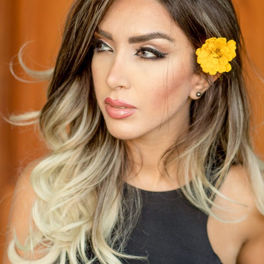 women wearing yellow flower hair pick